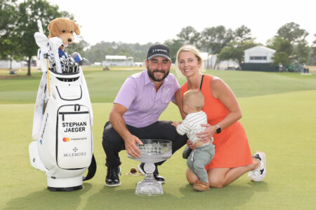 HOUSTON, TEXAS - MARCH 31: Stephan Jaeger of Germany poses for a photo with the trophy and his family after winning the Texas Children's Houston Open at Memorial Park Golf Course on March 31, 2024 in Houston, Texas. (Photo by Joe Scarnici/Getty Images)