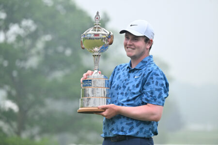 HAMILTON, ONTARIO - JUNE 02: Robert MacIntyre of Scotland celebrates with the trophy after winning the final round of the RBC Canadian Open at Hamilton Golf & Country Club on June 02, 2024 in Hamilton, Ontario, Canada. (Photo by Minas Panagiotakis/Getty Images)