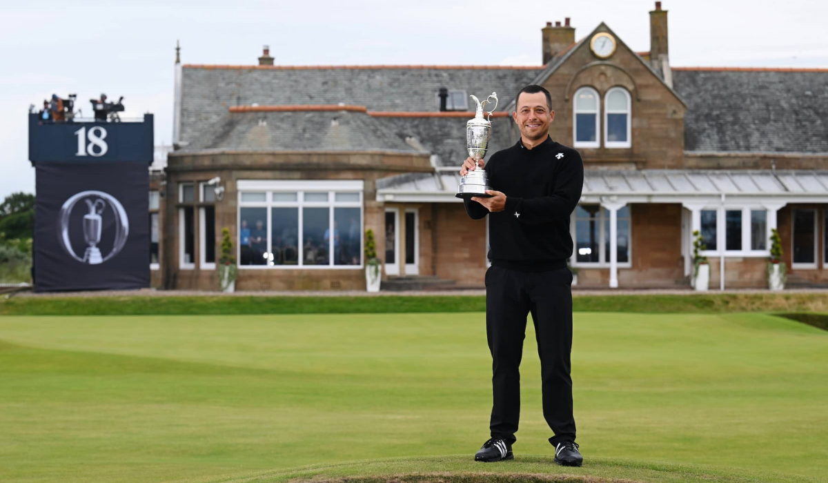 Xander Schauffele holds his Claret Jug