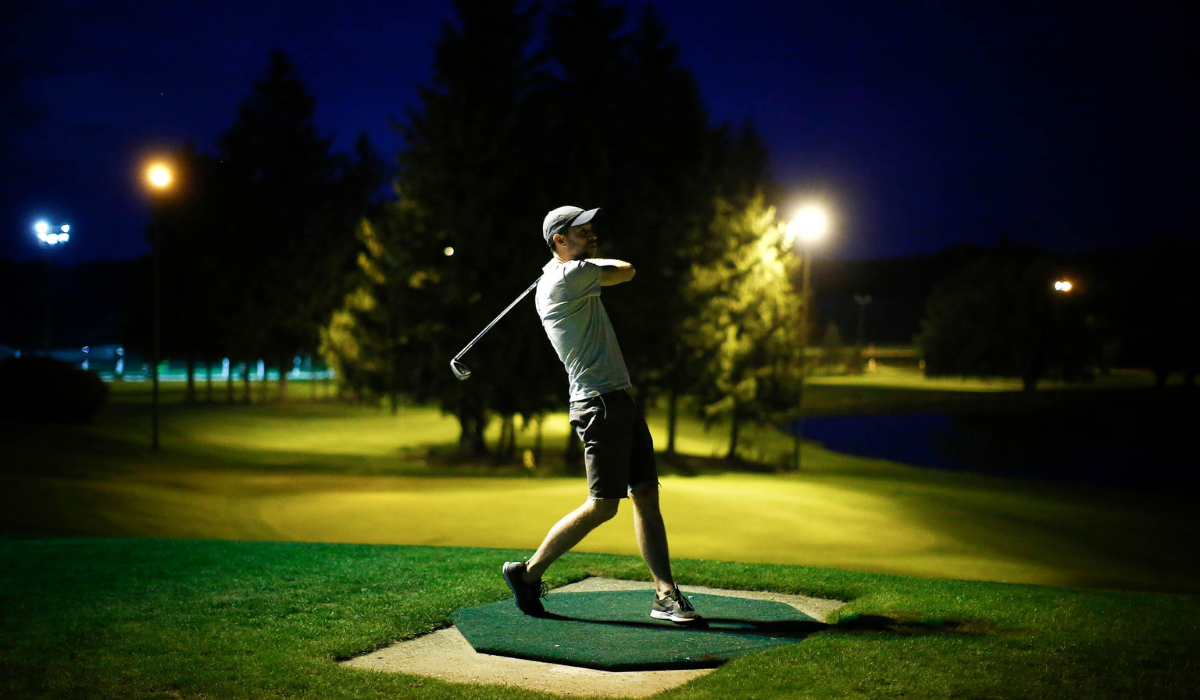 Golfer Playing Night Golf