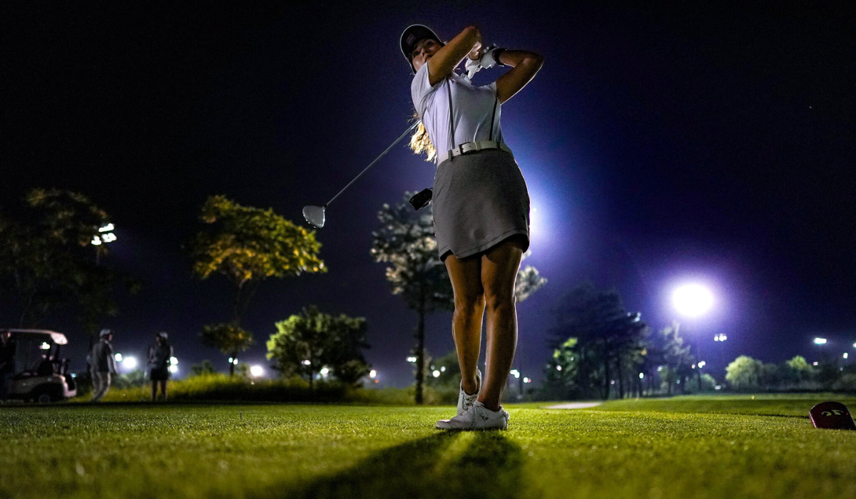 Golfer Playing Night Golf