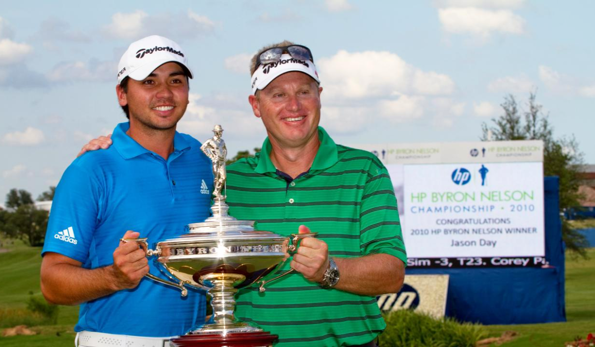 Jason Day posing with the HP Byron Nelson Championship trophy in 2010