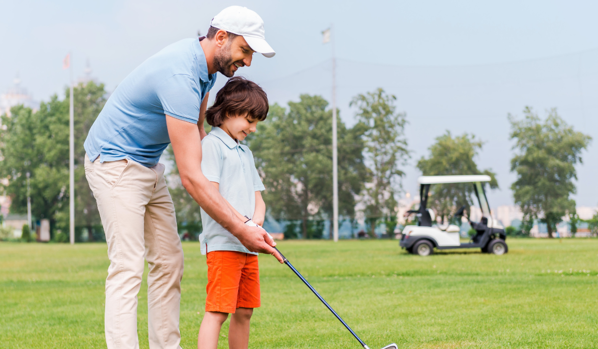 Junior Golfer Practicing with a Coach