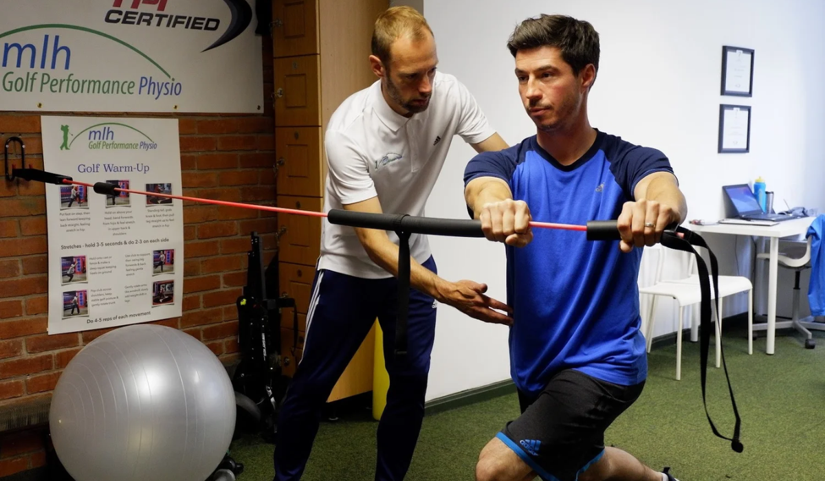 A Physiotherapist Assisting a Golfer with Mobility Work