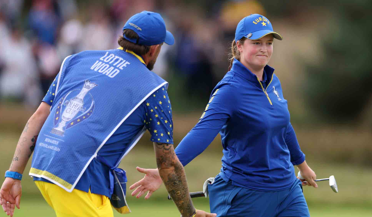 Lottie Woad of Team Europe Shake Hands with her Caddie at Solheim Cup 2026